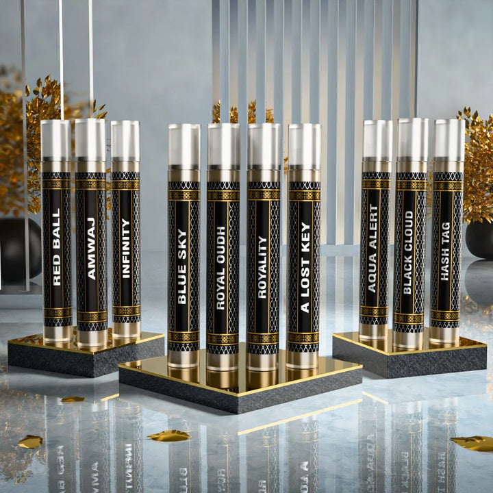 10 sample attar perfume set featuring Red Ball, Amvnaj, Infinity, Blue Sky, Royal Oudh, Royality, Al Lost Key, Aqua Alert, Black Cloud and Hash Tag by Fahaliya’s.