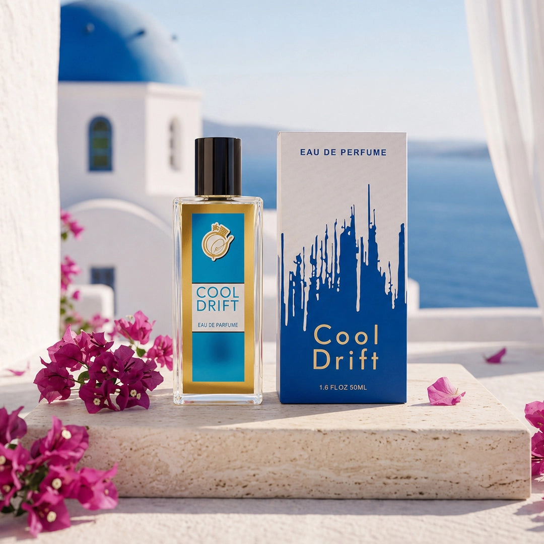 Cool Drift Eau De Perfume 50ml in a clear rectangular bottle with premium white-and-blue packaging, set against a coastal outdoor backdrop.
